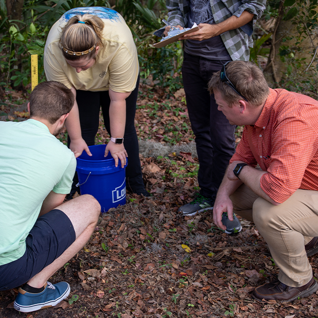 An instructor giving an outdoor lecture.
